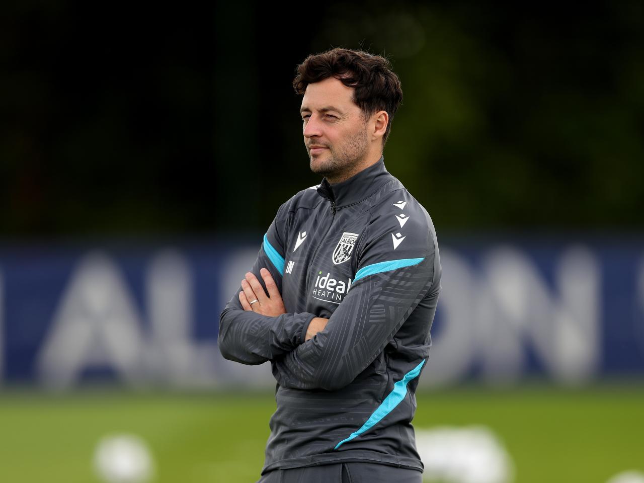 Ryan Mason watching training 