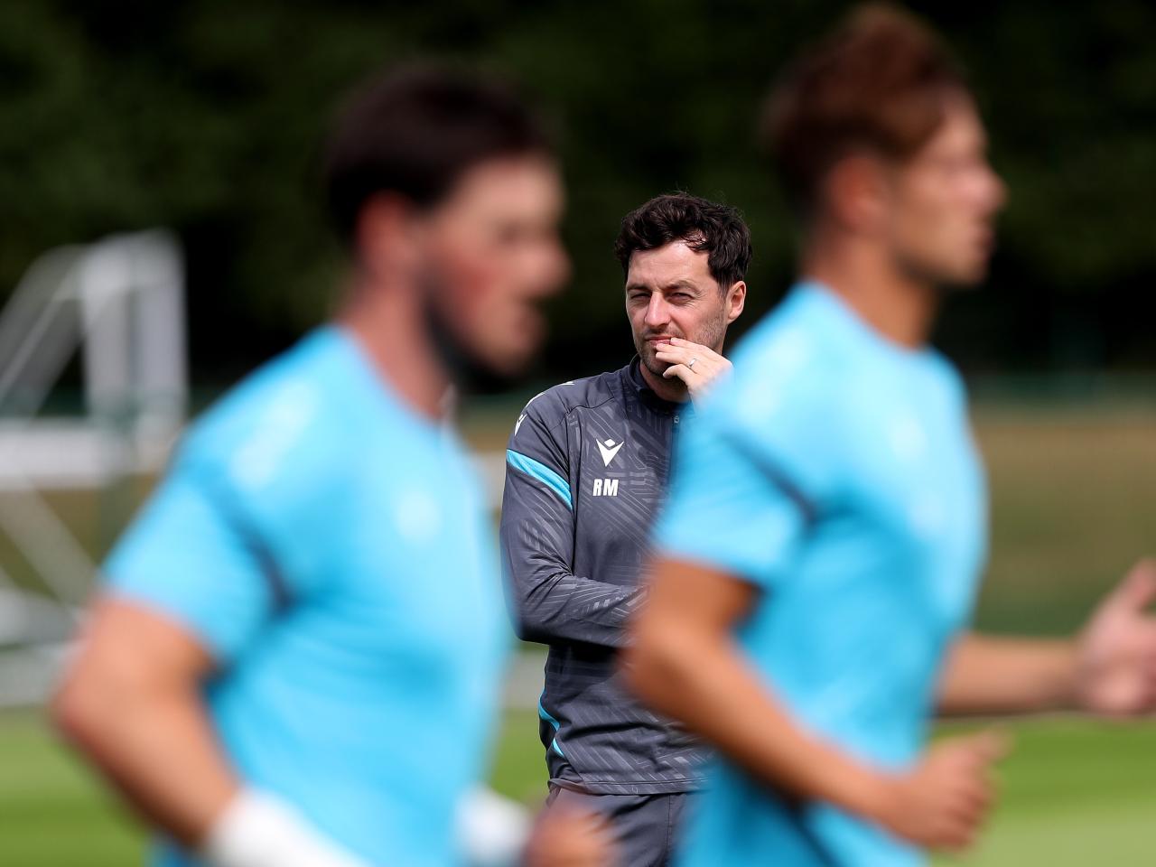 Ryan Mason watching training