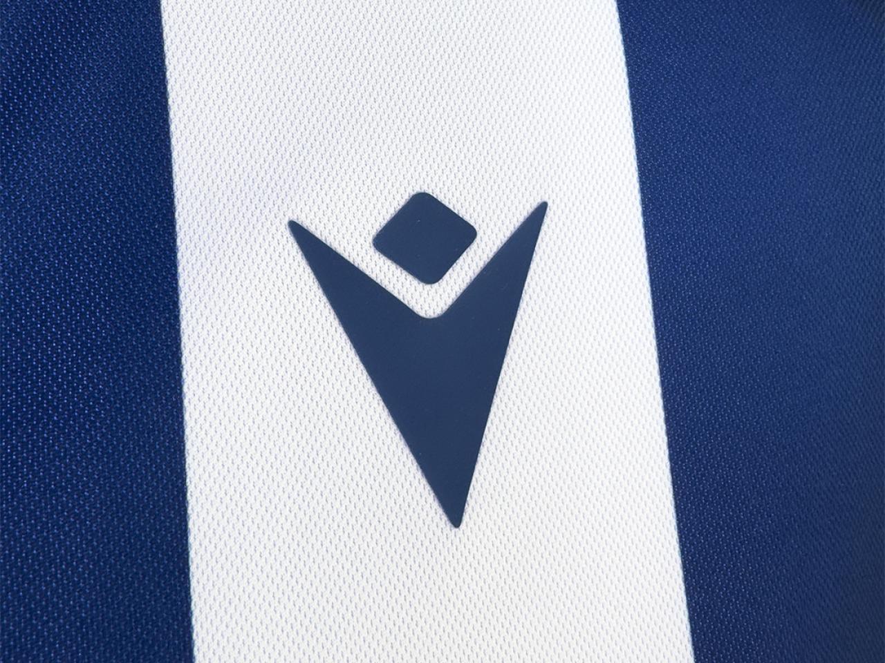 Our 2025/26 home kit. The Macron logo.