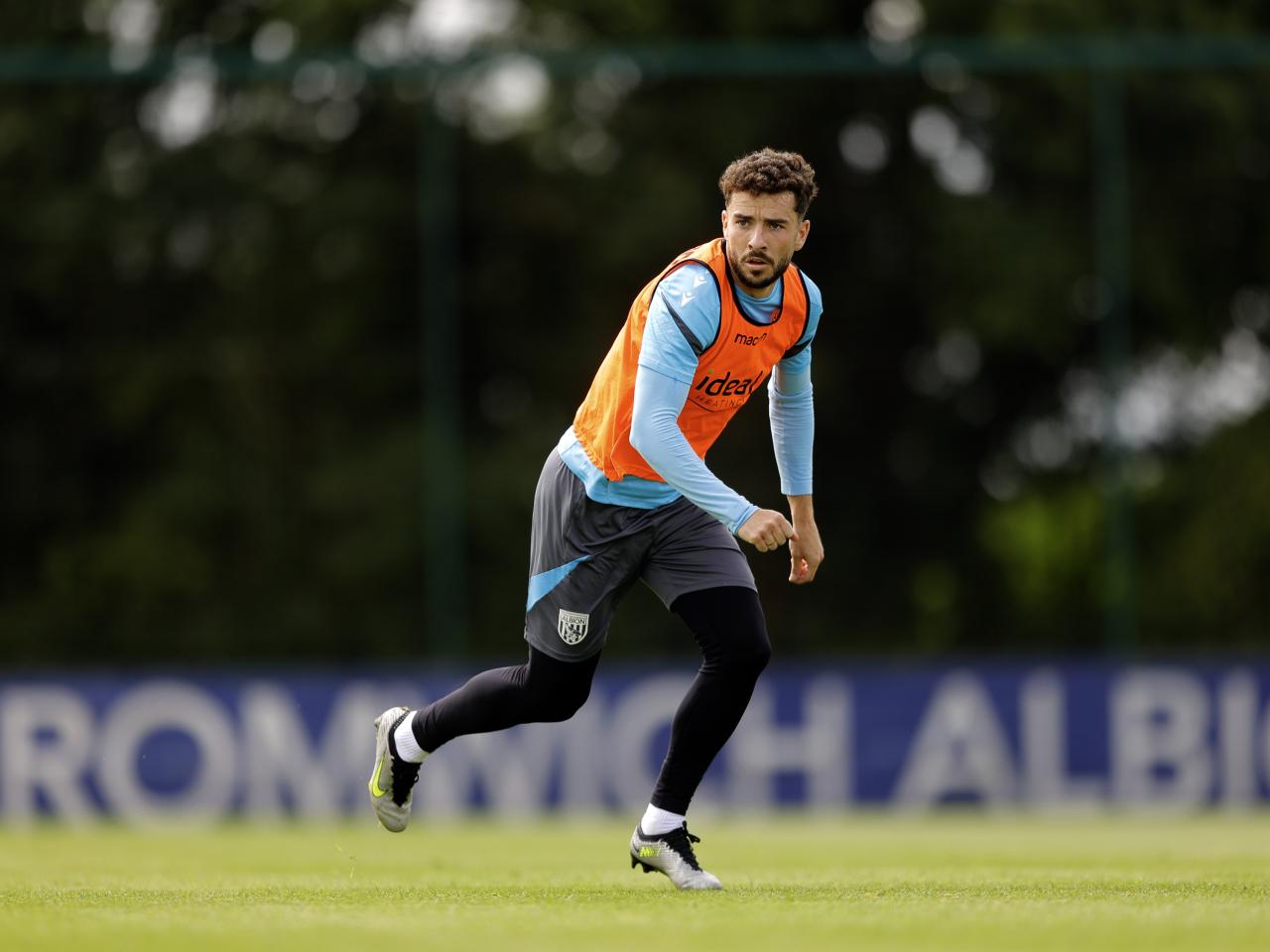 Mikey Johnston running forward looking for the ball during training