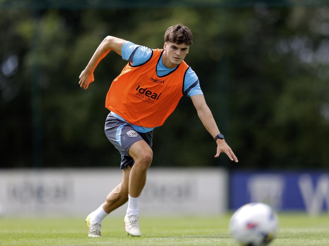 Alex Williams chasing the ball during training 