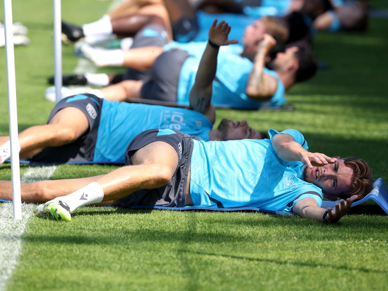 Albion players stretching before a training session