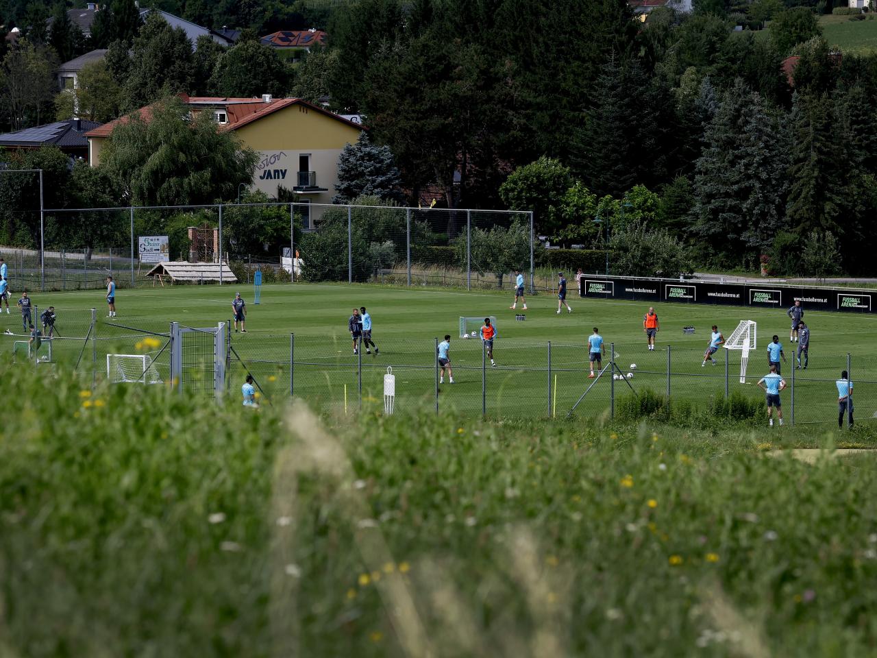 A general view of training from a vantage point with the pitch at the bottom of the hills