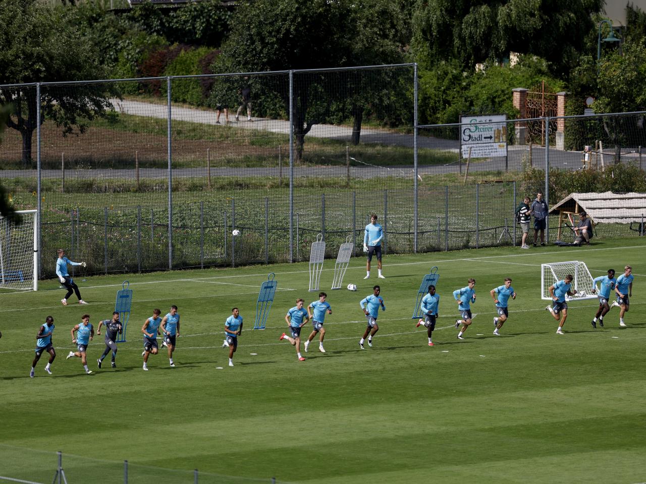 A general view of training from a vantage point with the pitch at the bottom of the hills