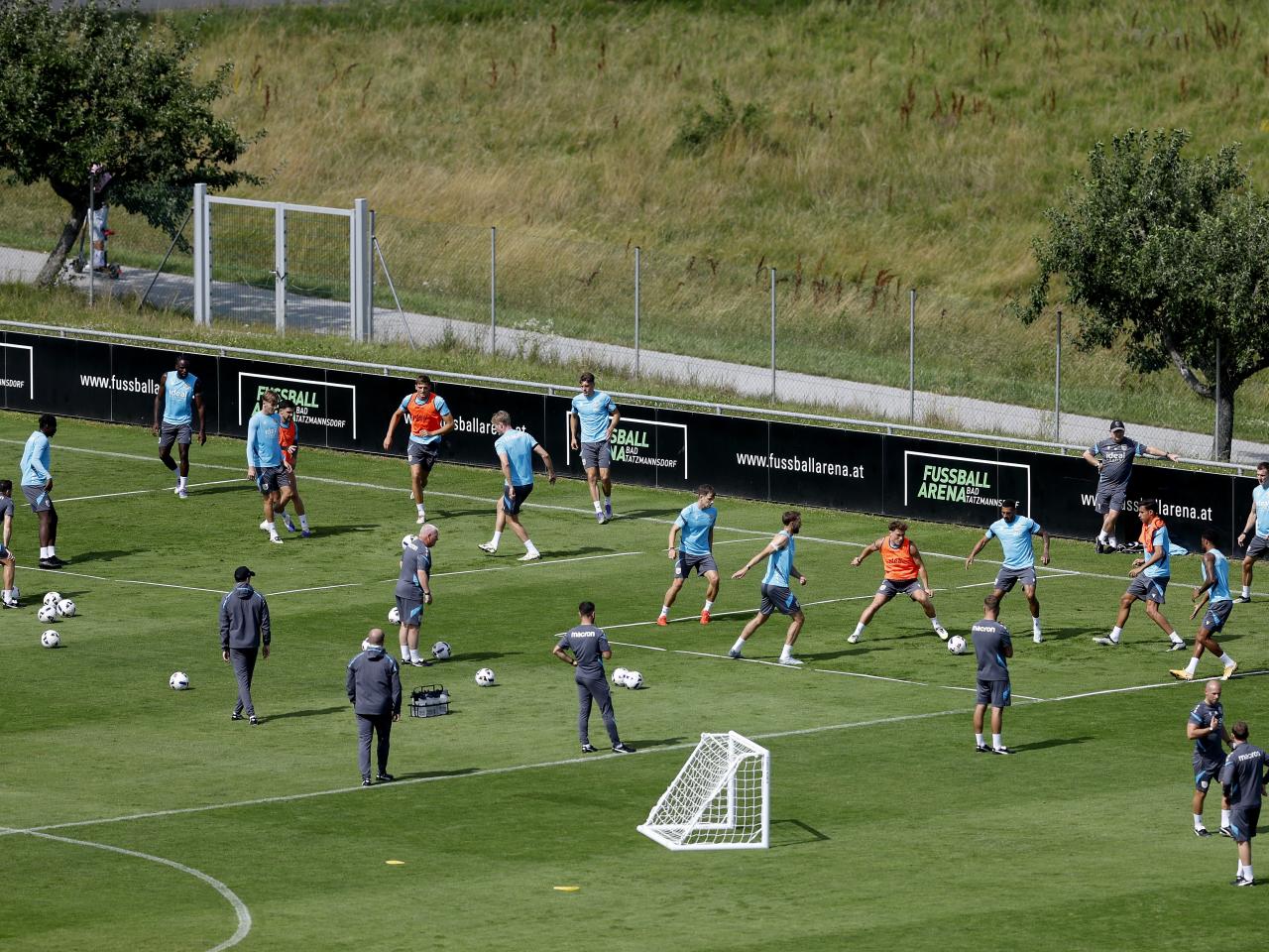 A general view of training from a vantage point with the pitch at the bottom of the hills