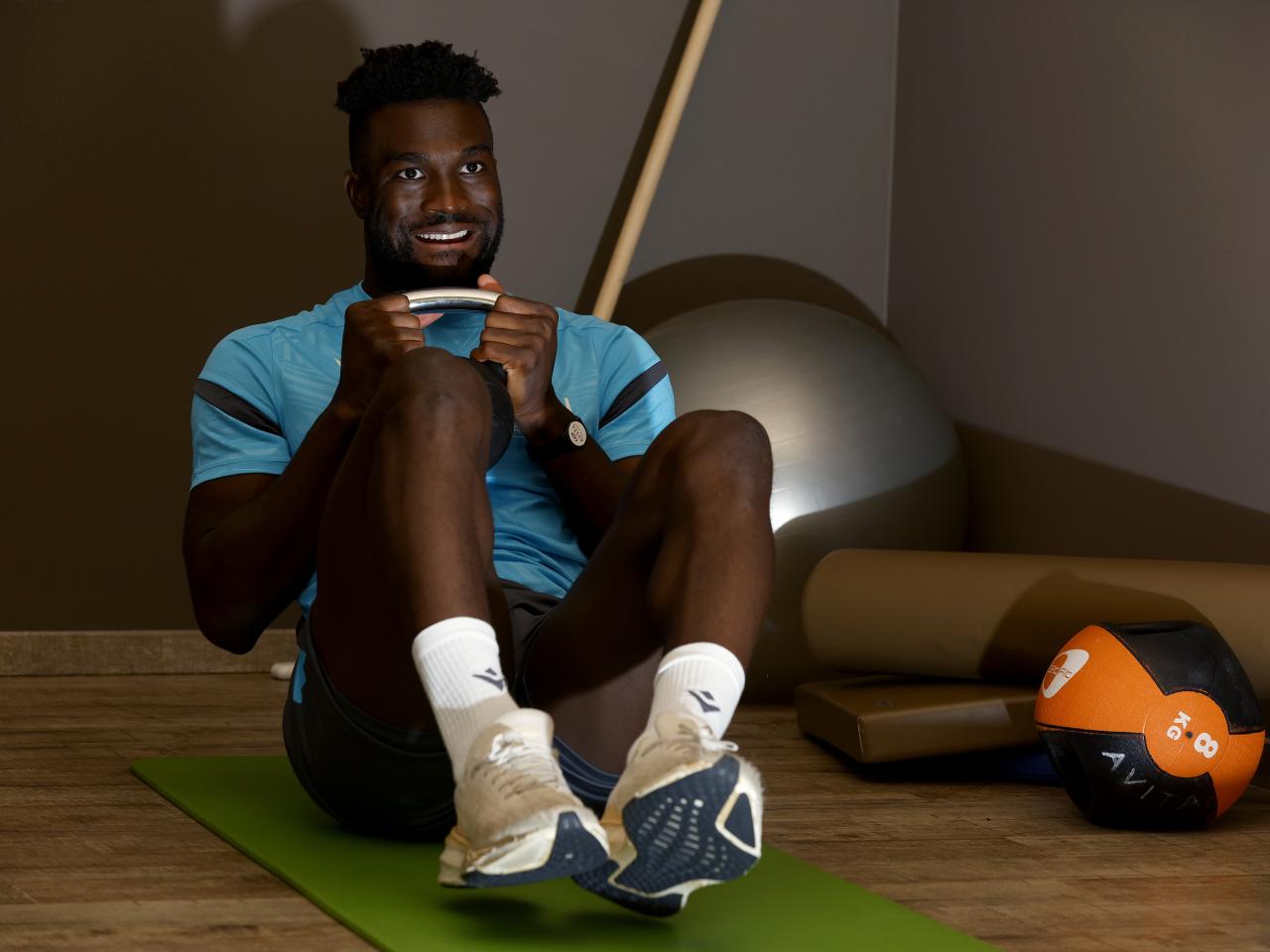 Daryl Dike working in the gym with a kettlebell weight