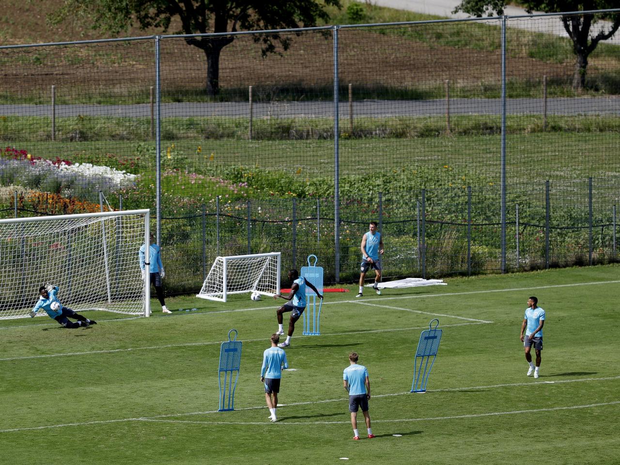 A general view of training from a vantage point with the pitch at the bottom of the hills