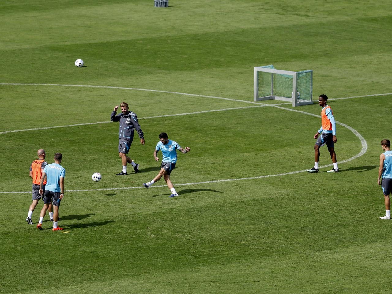 A general view of training from a vantage point with the pitch at the bottom of the hills