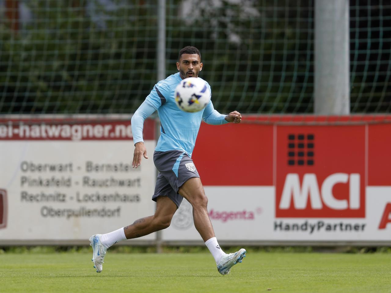 Karlan Grant watching the ball during a training session in Austria 