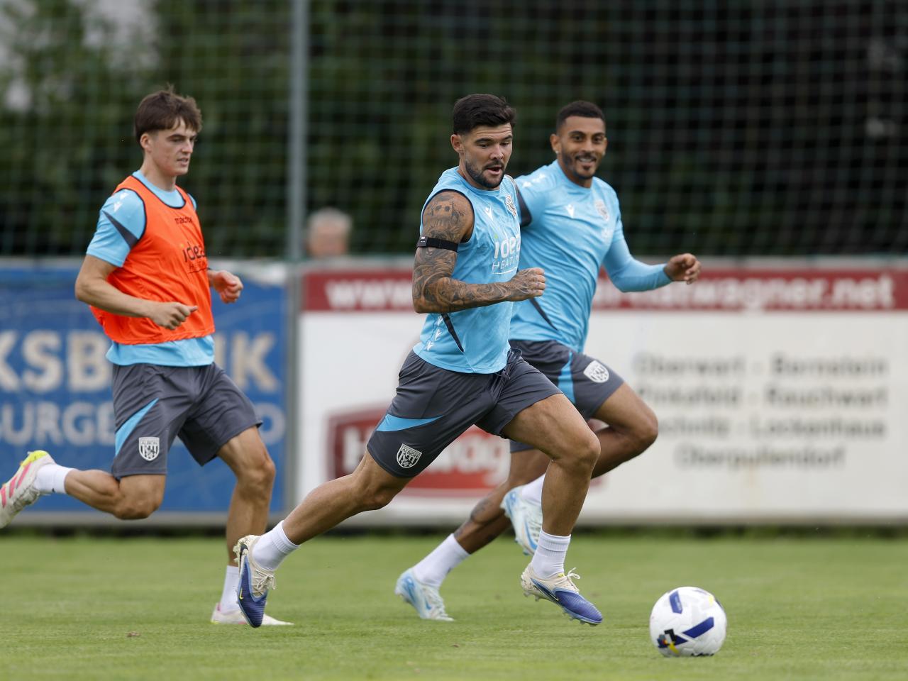 Alex Mowatt on the ball during a training session in Austria with Alex Williams and Karlan Grant behind him