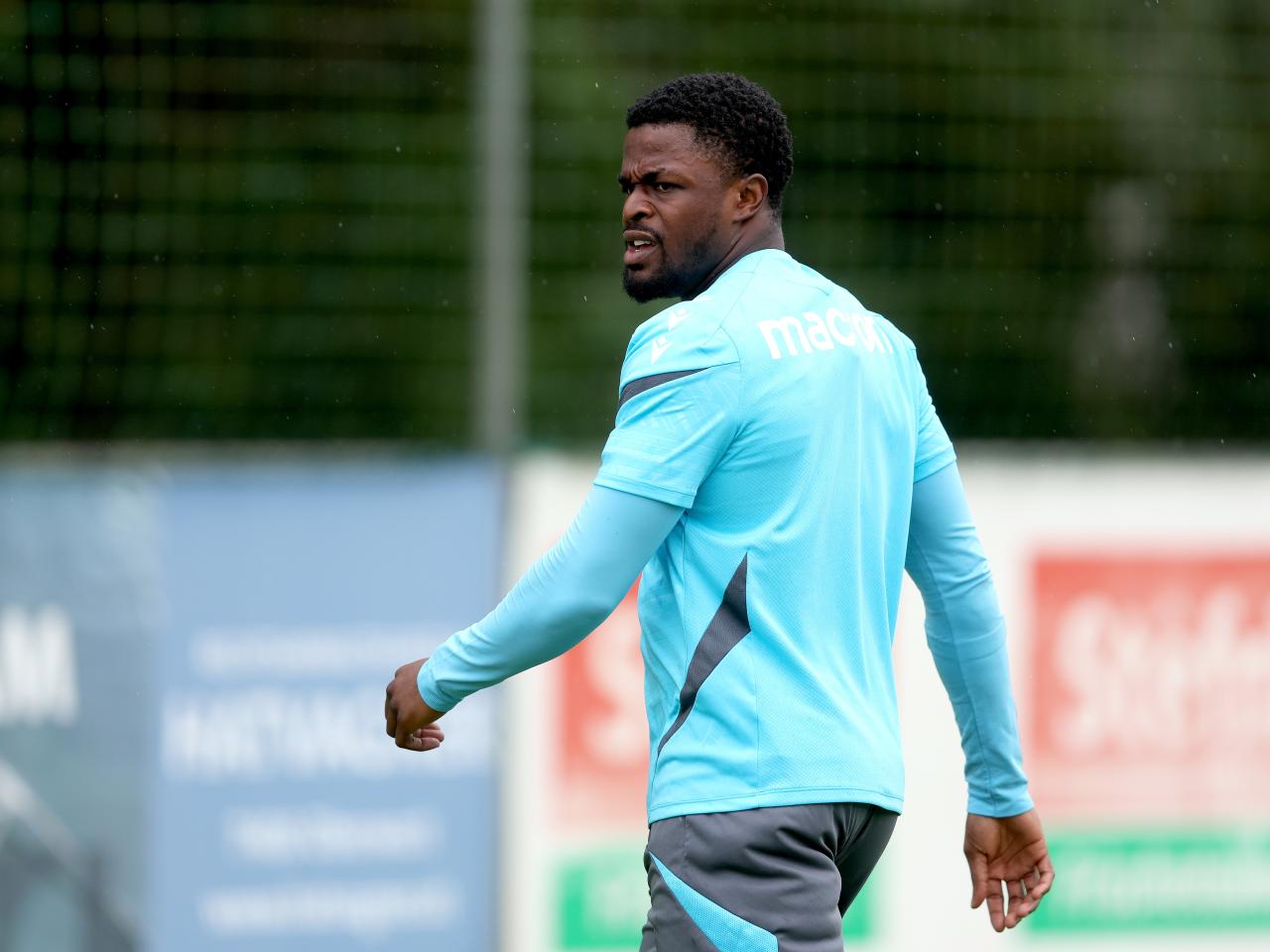 Josh Maja looking to the side during a training session in the rain