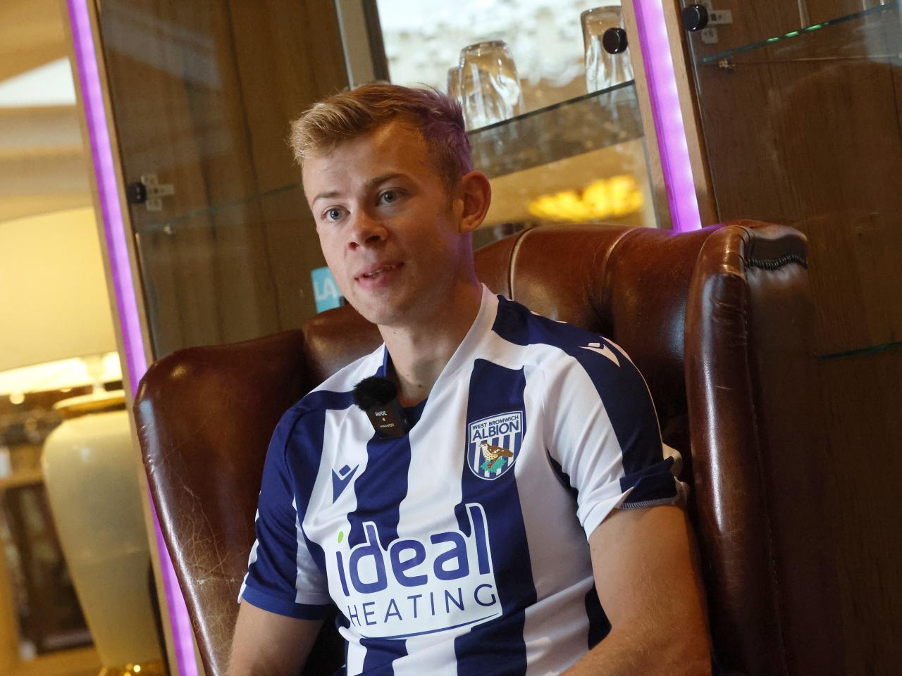 Aune Heggebø sat in a WBA shirt in a chair being interviewed by WBA TV