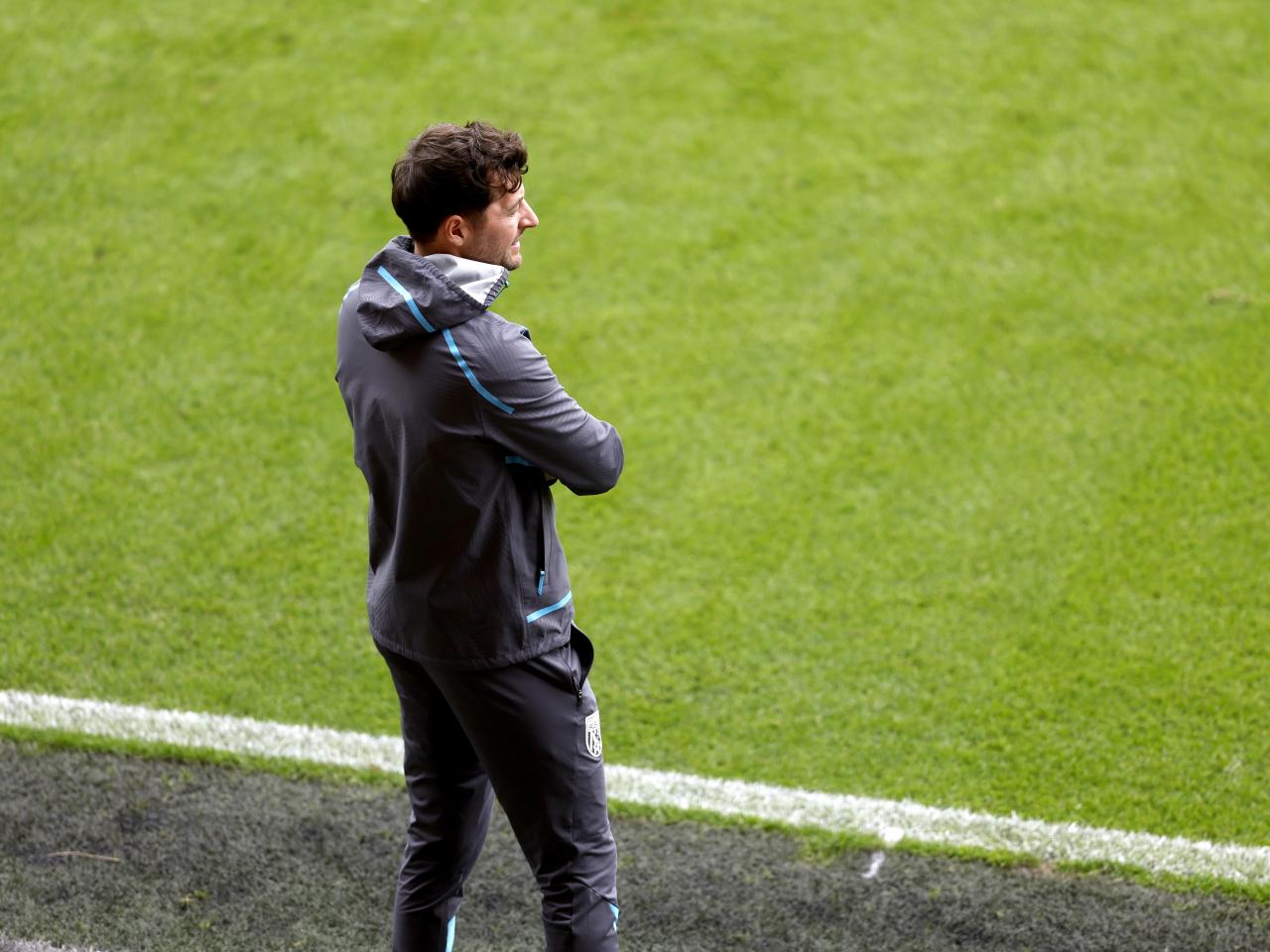 Ryan Mason watching Blackpool v WBA from the dugout 