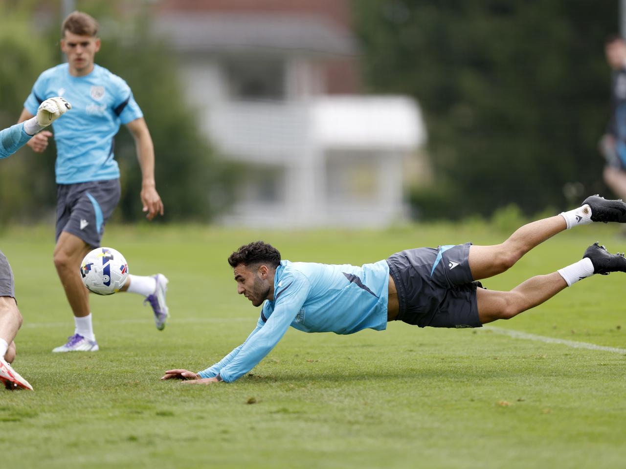 Tammer Bany diving for a header during training