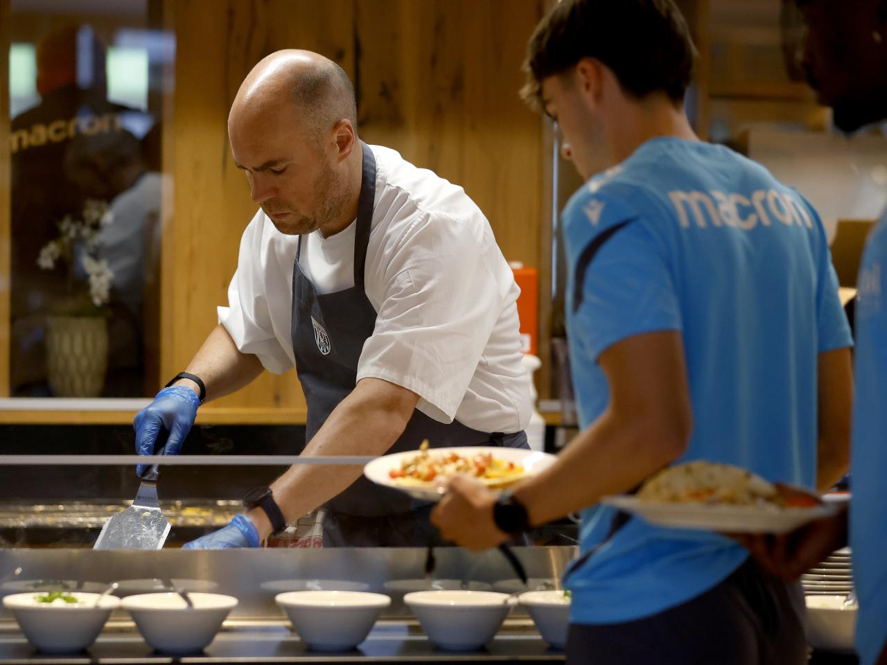 A WBA chef preparing food for a player at the hotel