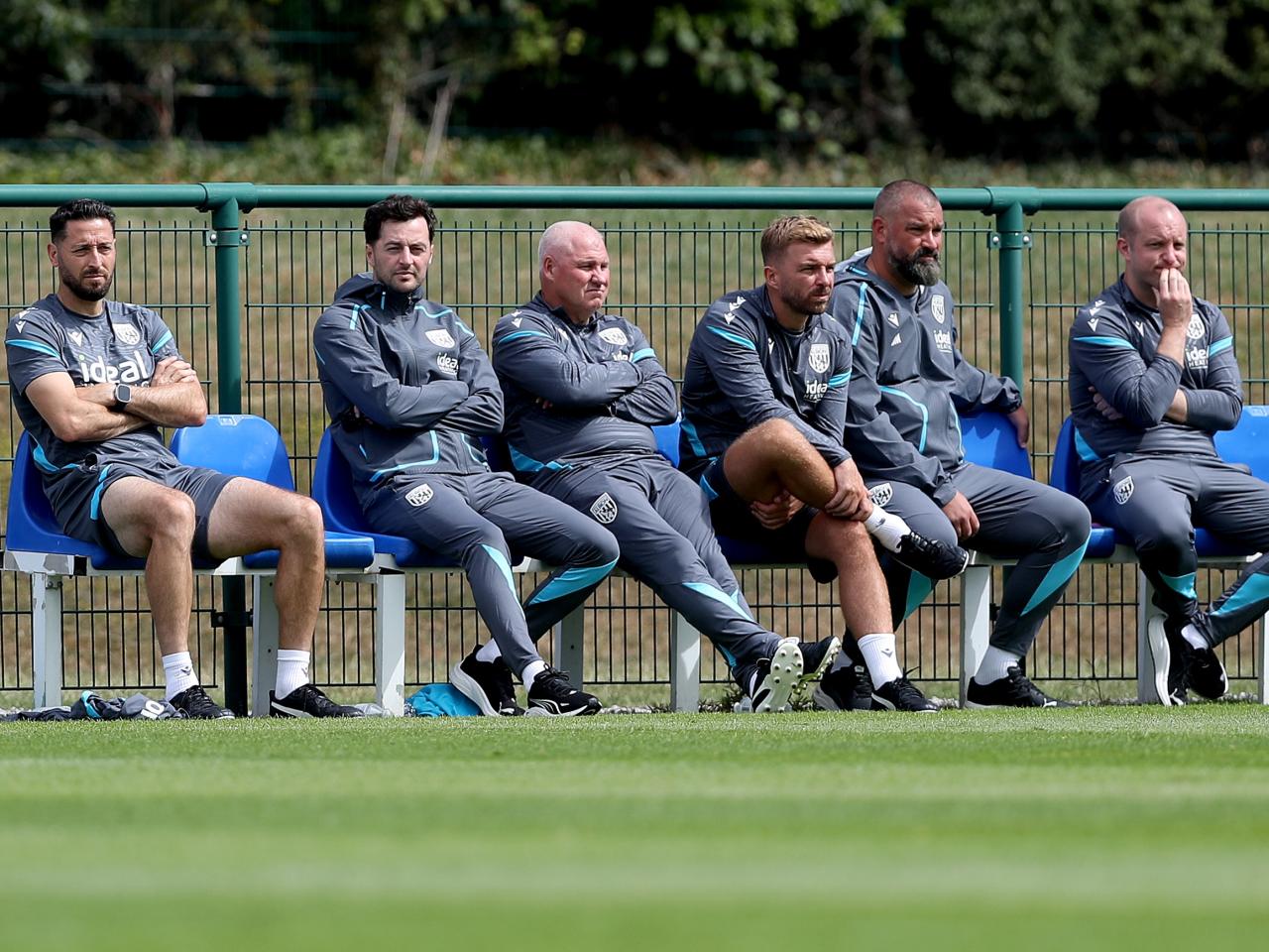Albion's coaching staff sat watching WBA v Port Vale 