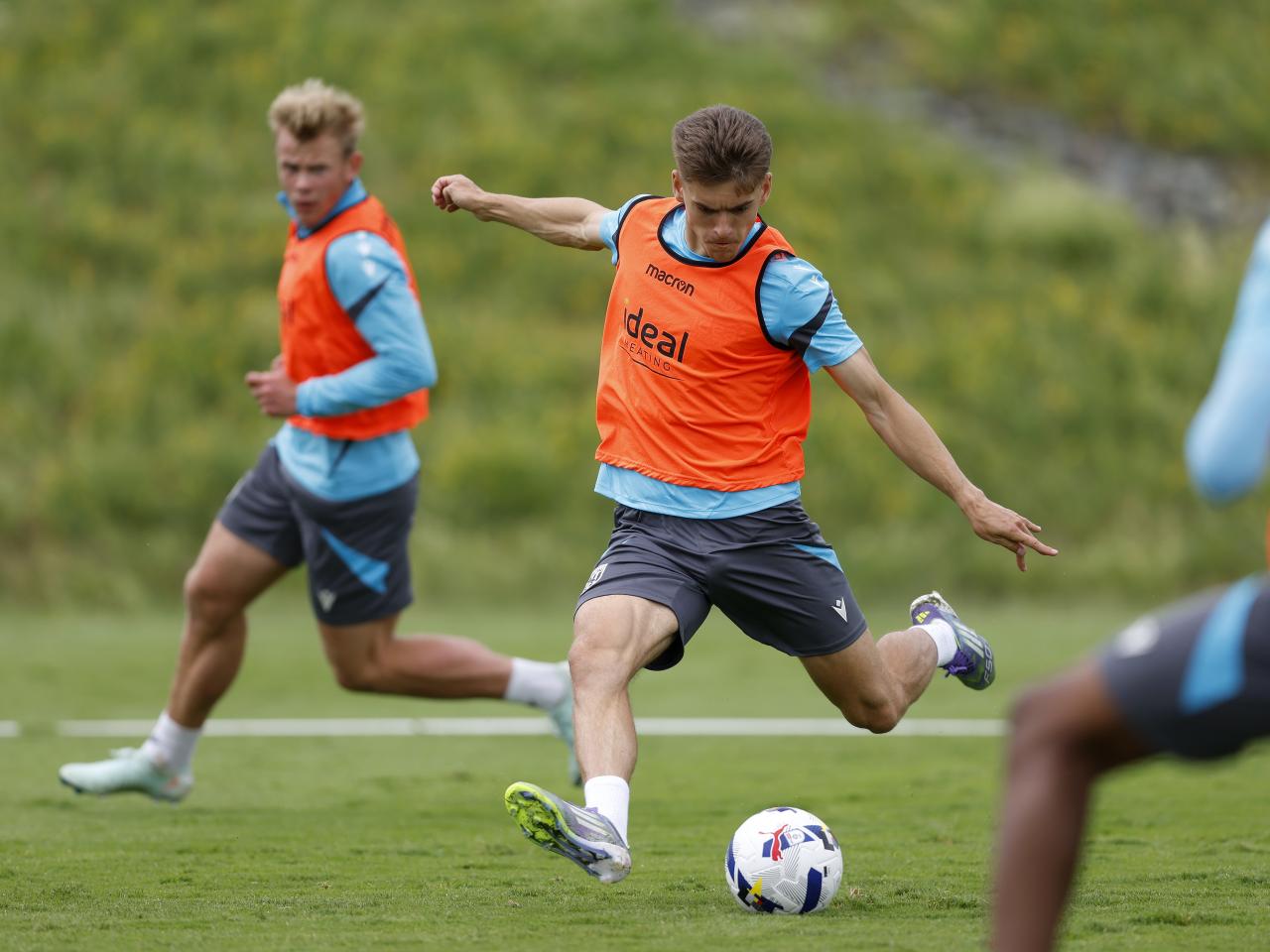 Tom Fellows striking the ball during training