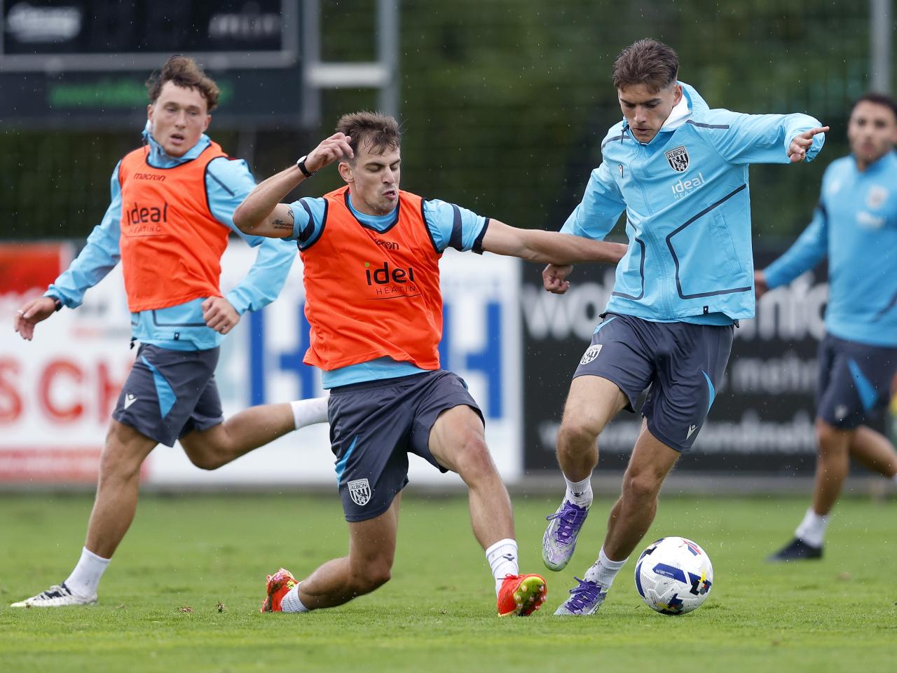 Jayson Molumby and Tom Fellows fight for the ball during a training session in Austria 