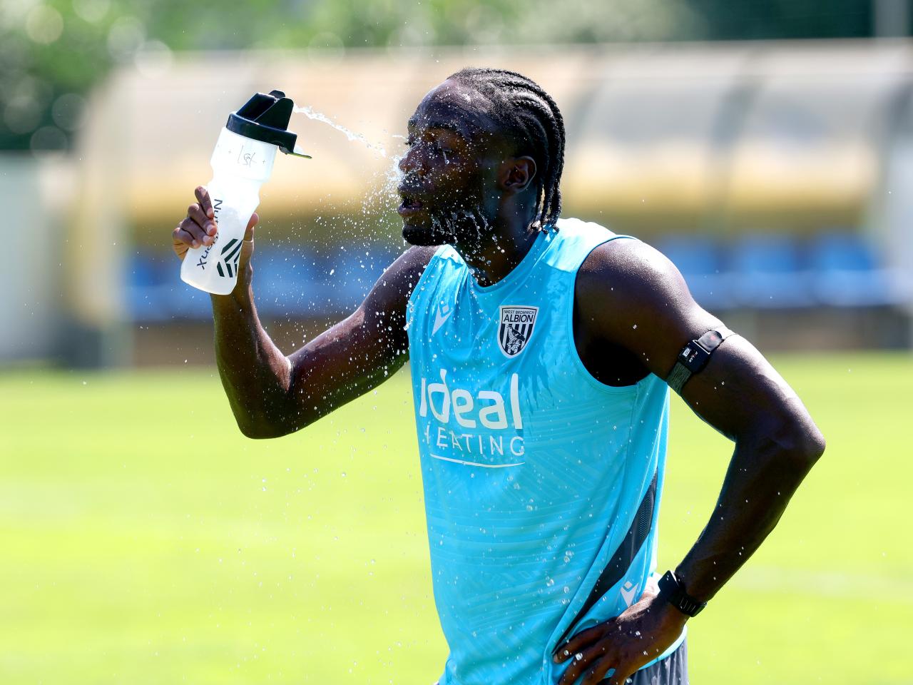 Devante Cole squirting water in his face