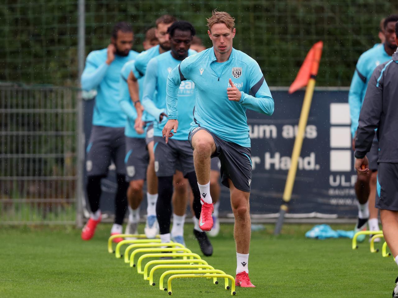 Torbjørn Heggem warming up before a training session in the rain