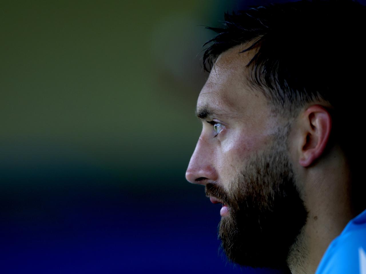 A close up of the side of Nat Phillips' face 