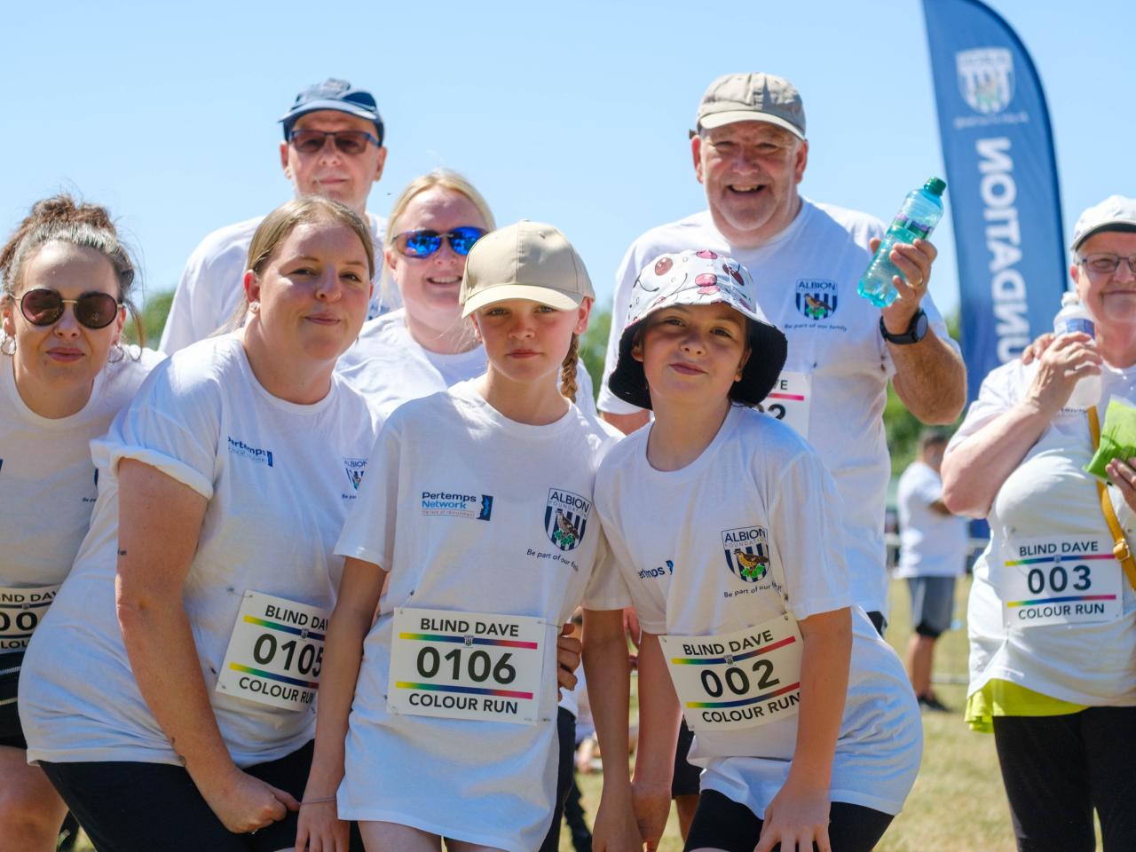 Family of participants smiling for the photo.