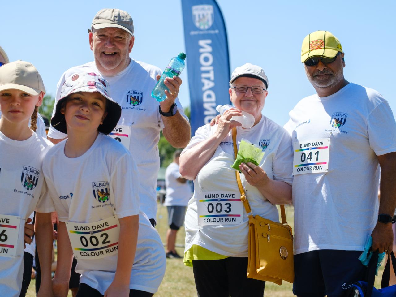 Family of participants smiling for the photo.