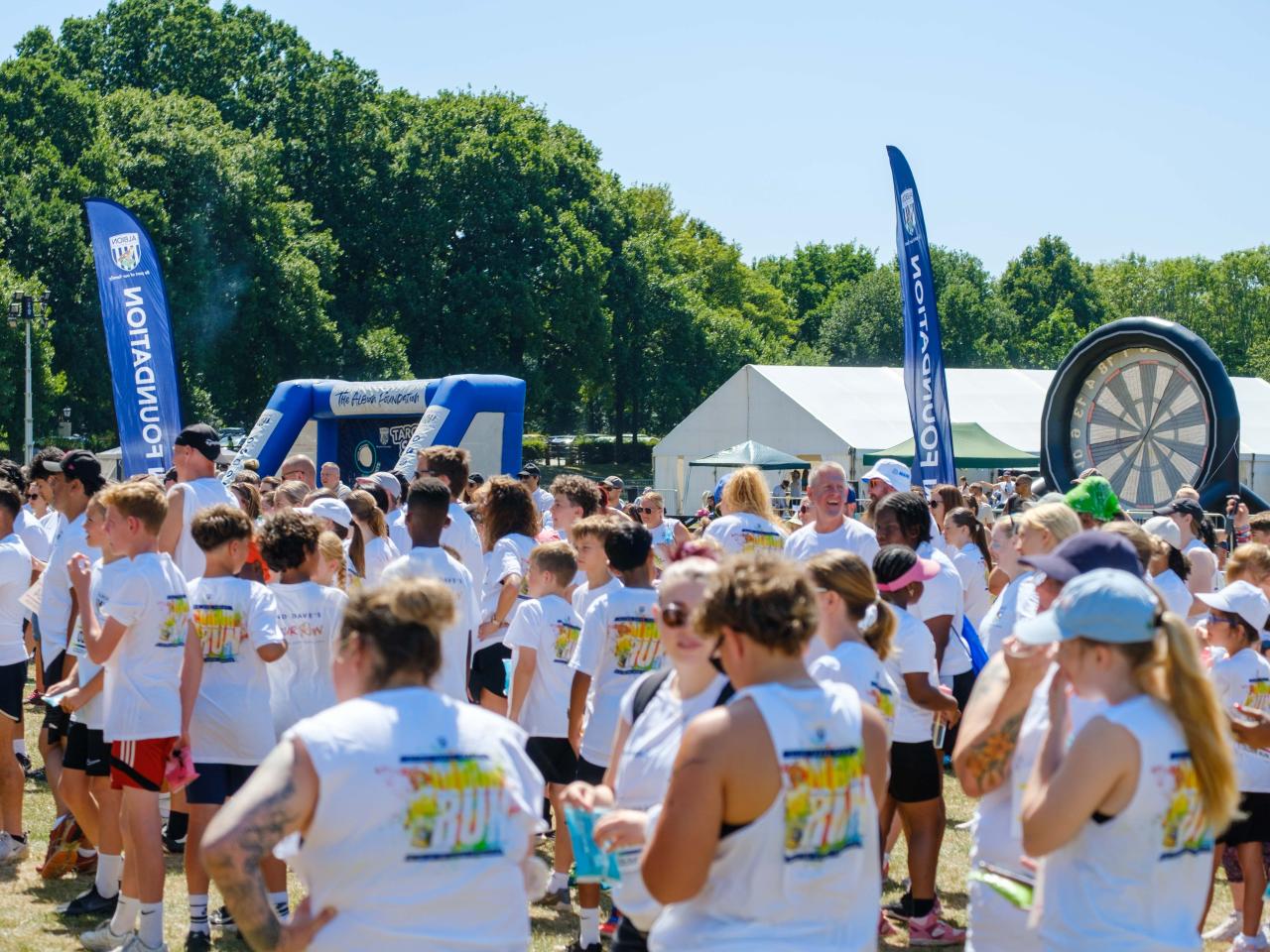 Wide view of participants warming up.