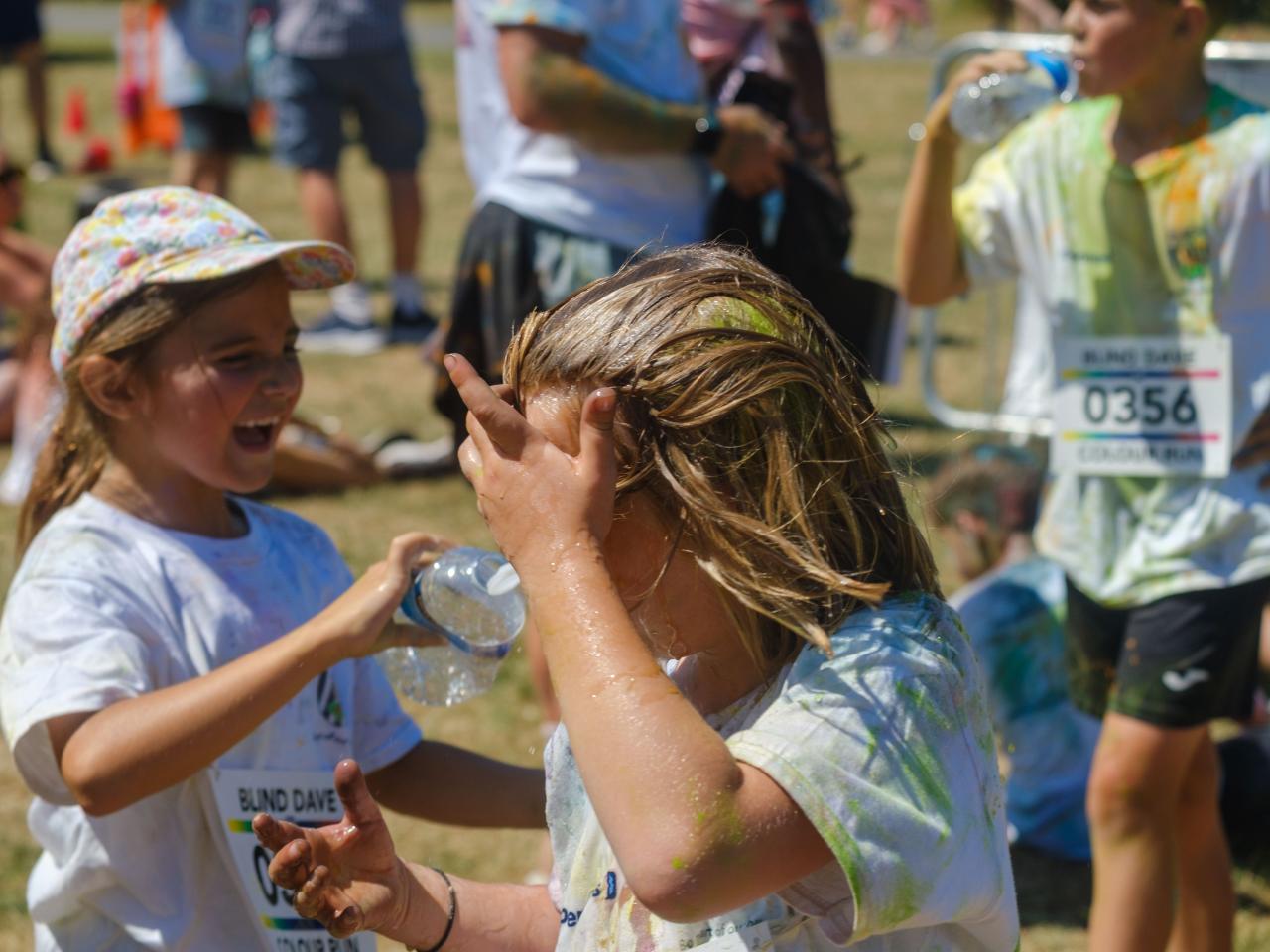Closing up of young participant, after running water over hair.