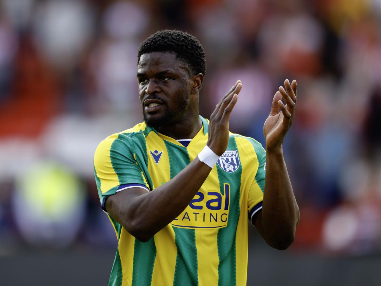 A photo of Josh Maja applauding the Albion fans at Lincoln