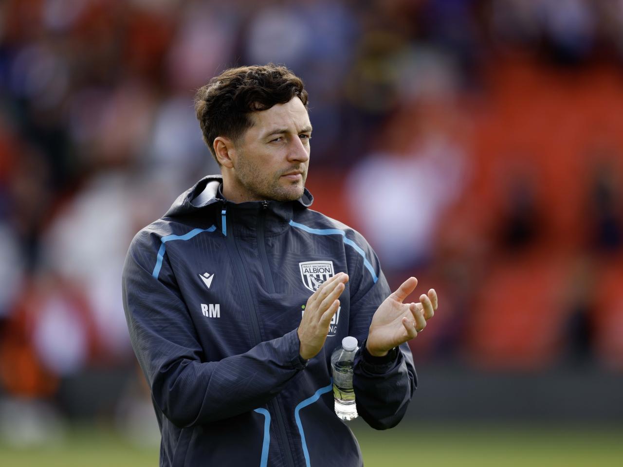 A photo of Ryan Mason applauding the Albion fans at Lincoln