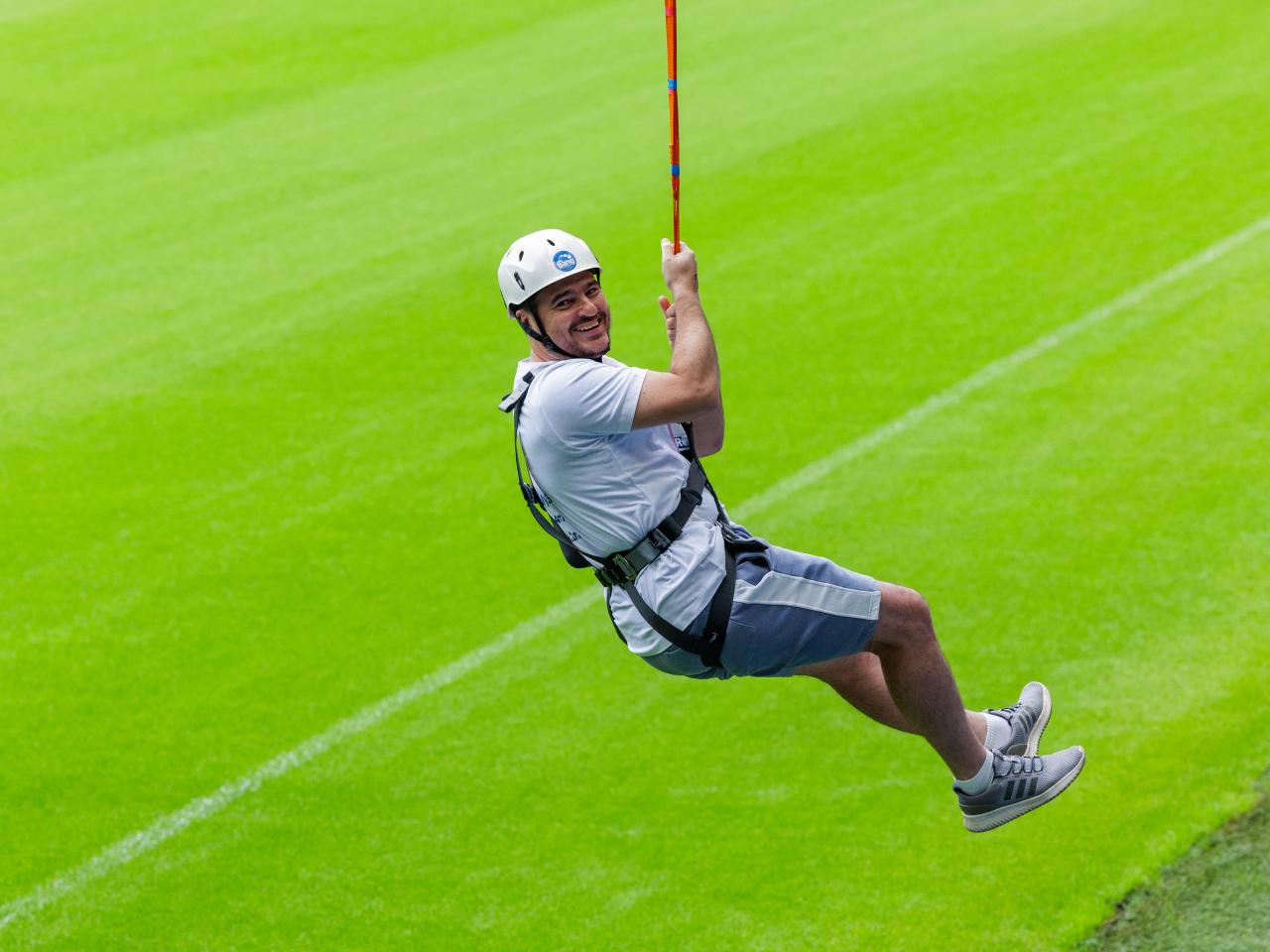 A participant zip wires across The Hawthorns.