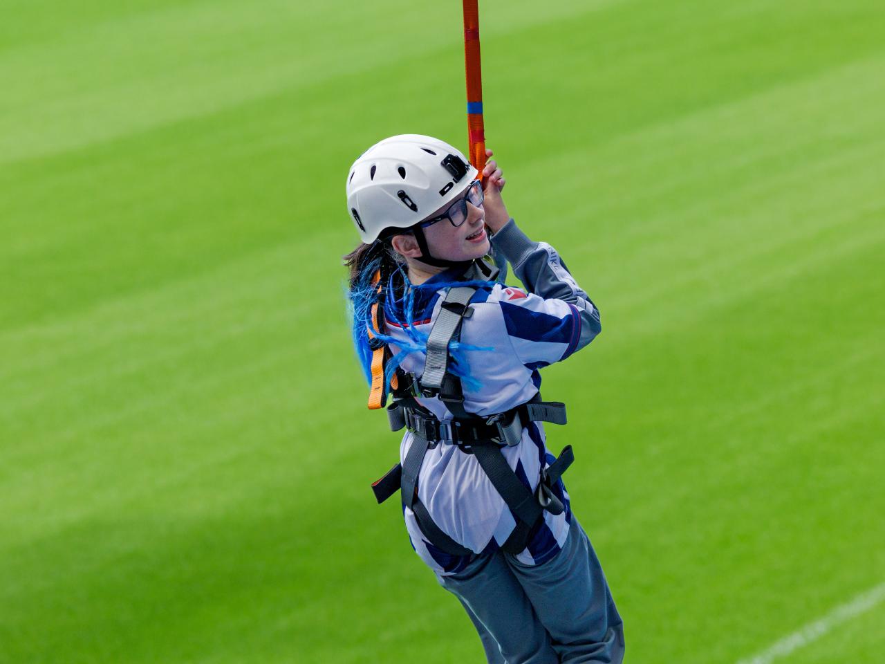 A participant zip wires across The Hawthorns.