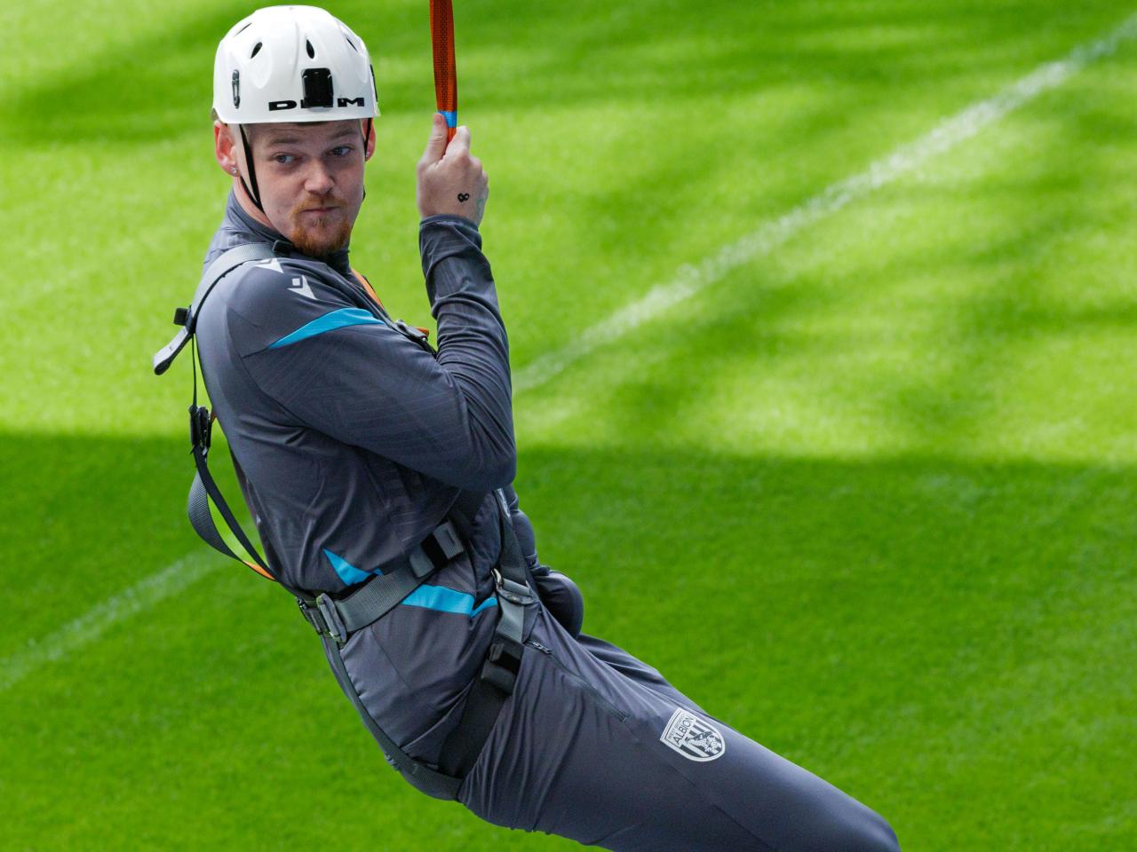 A participant zip wires across The Hawthorns.