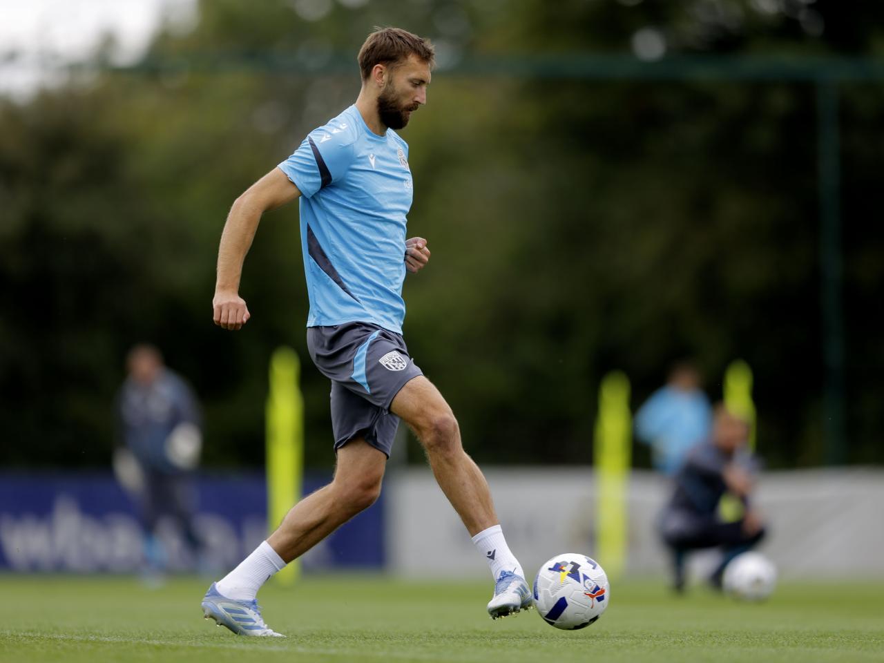 Nat Phillips passing the ball during training 