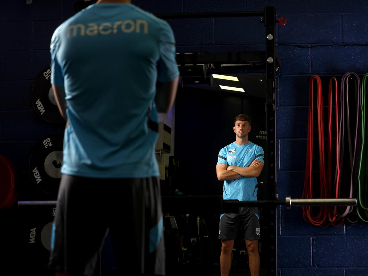 Chris Mepham looking in a mirror in the gym