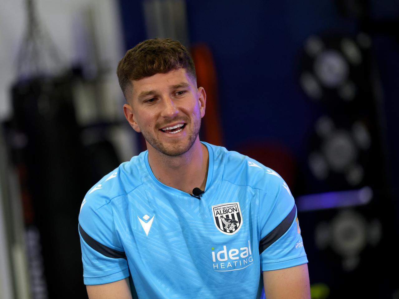 Chris Mepham smiling while sat in the gym