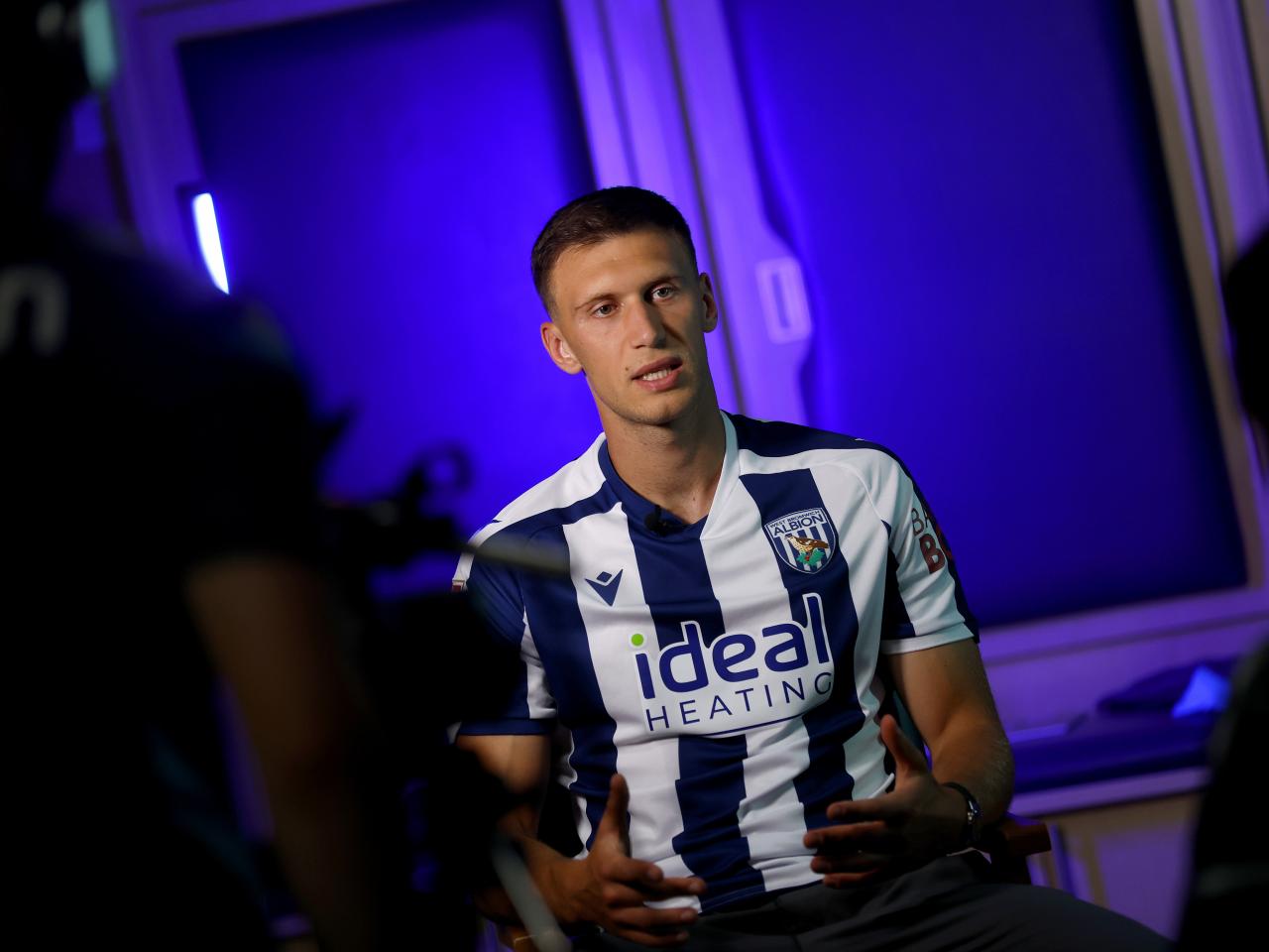 Krystian Bielik in a home shirt being interviewed by WBA TV