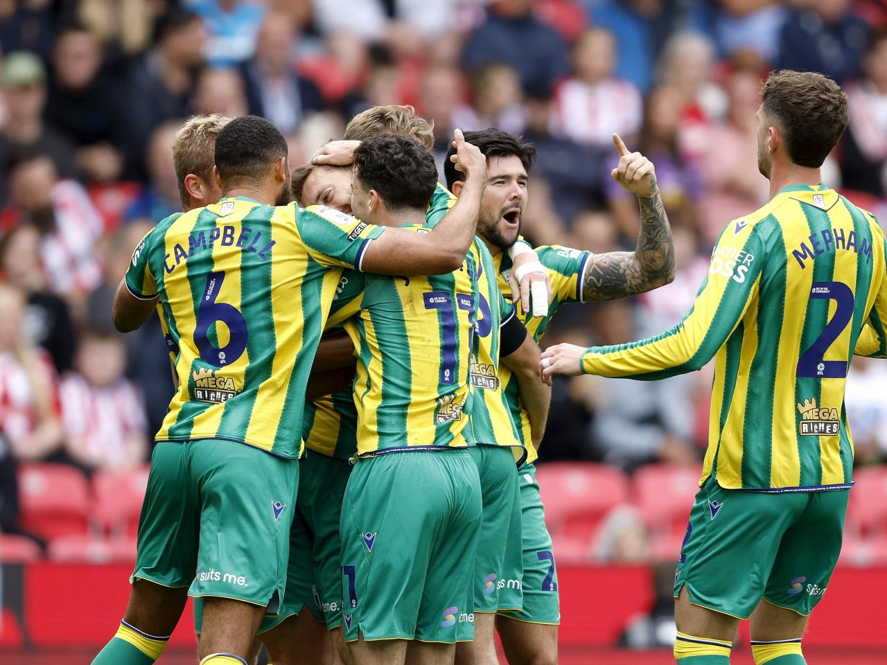Nat Phillips celebrates scoring v Stoke with team-mates