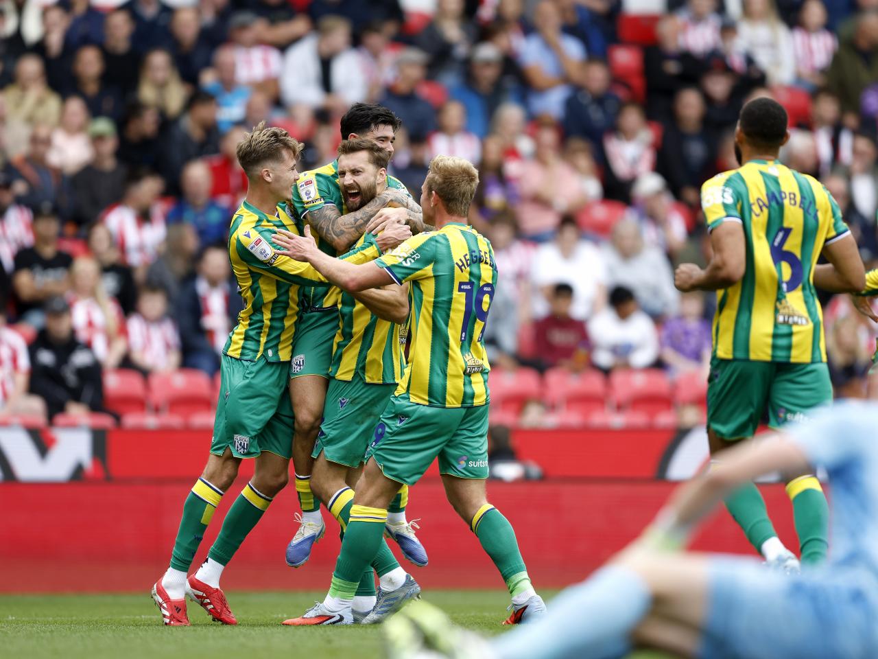Nat Phillips celebrates scoring v Stoke with team-mates