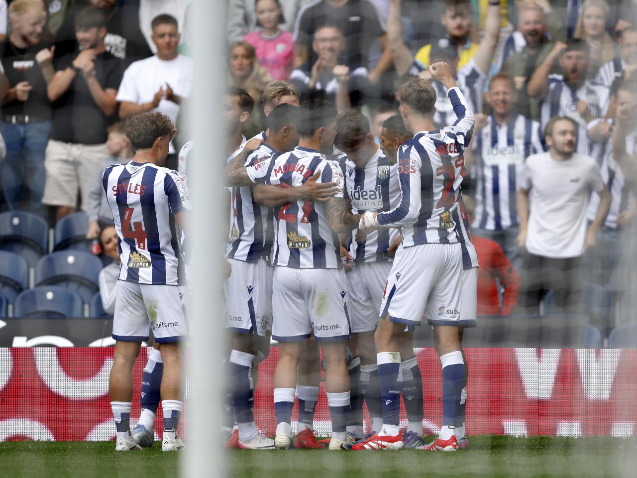 Isaac Price celebrates with team-mates after scoring against Blackburn 