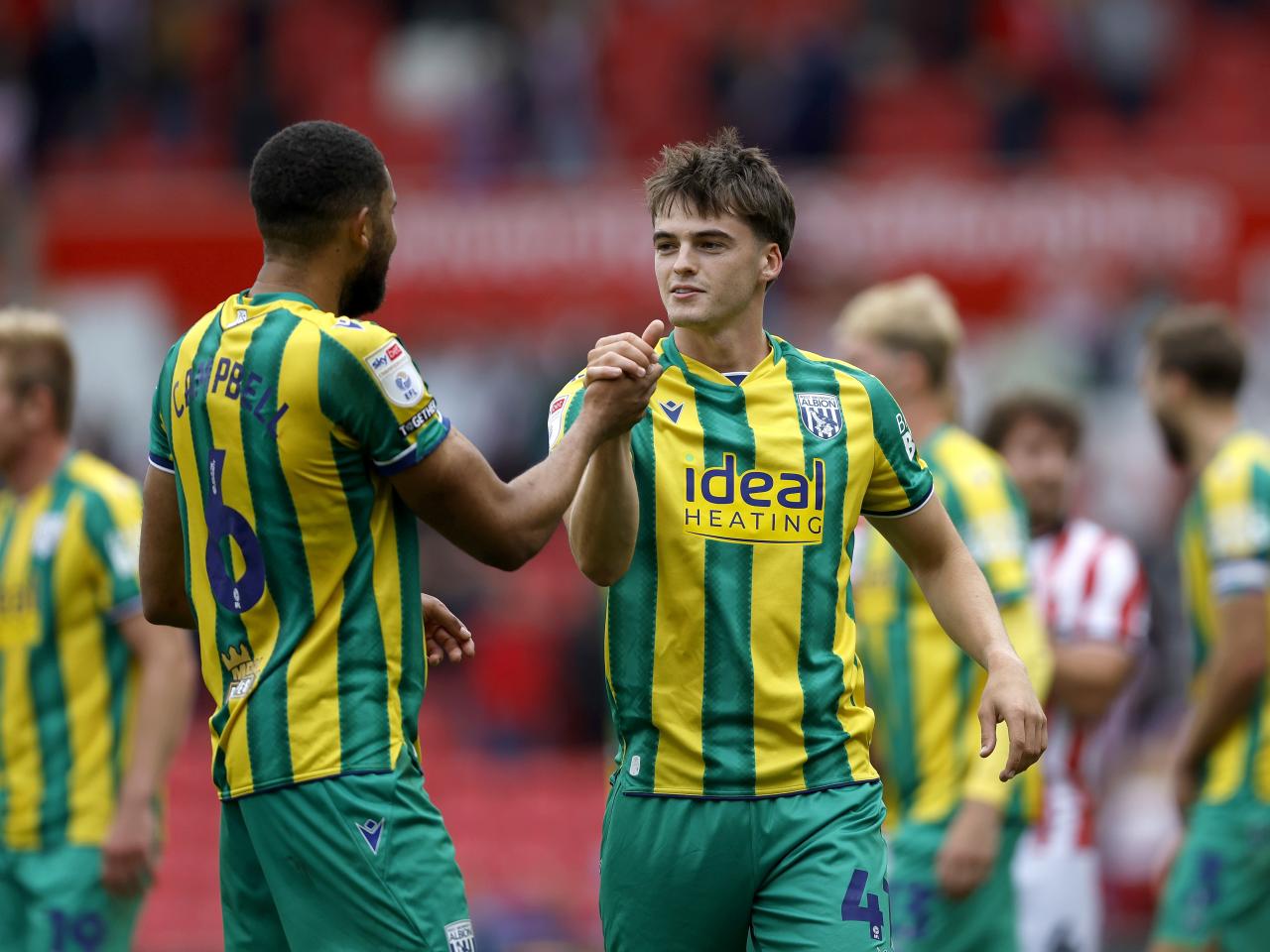 George Campbell and Alex Williams applauding WBA fans at Stoke