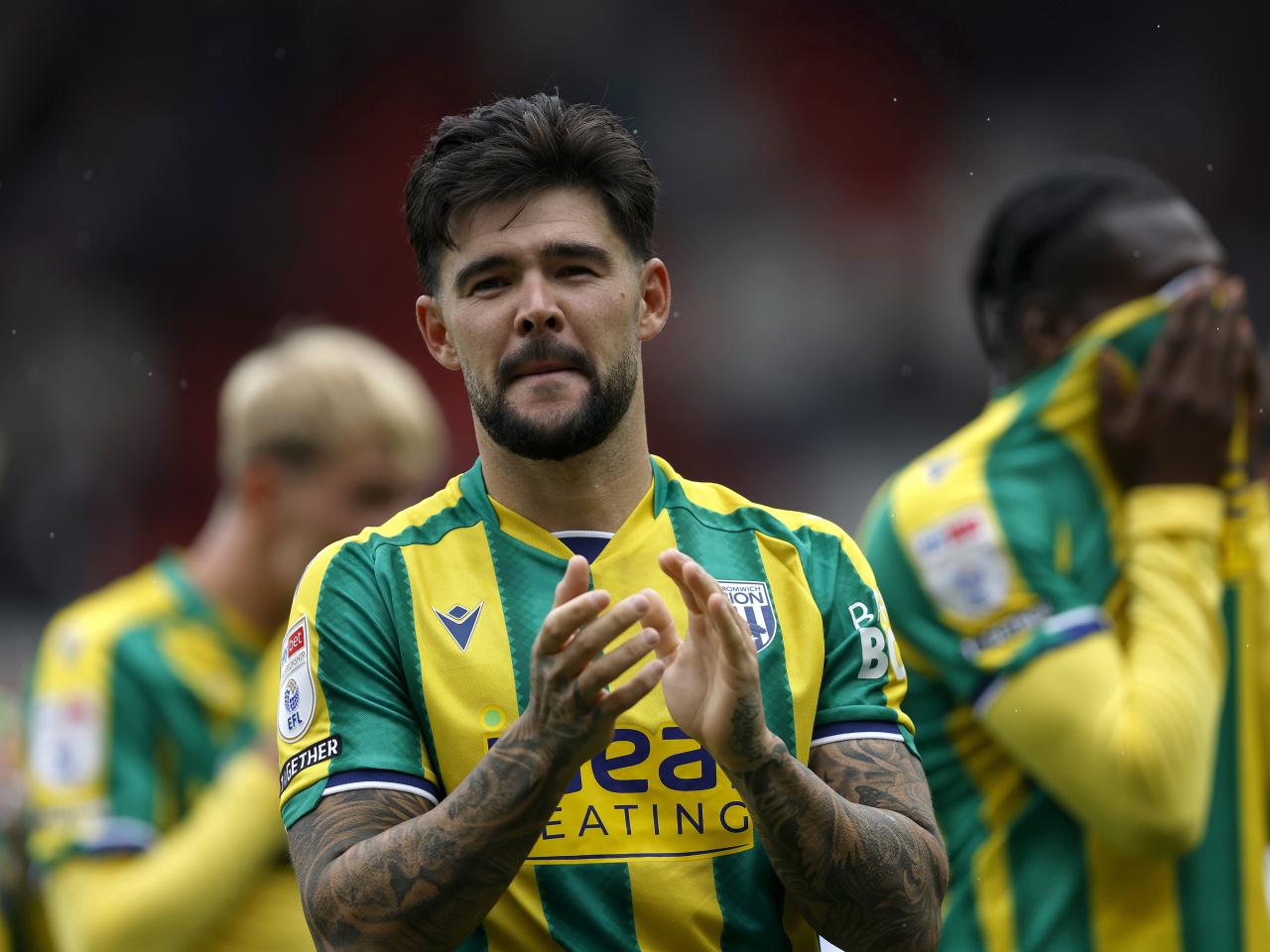 Alex Mowatt applauding WBA fans at Stoke