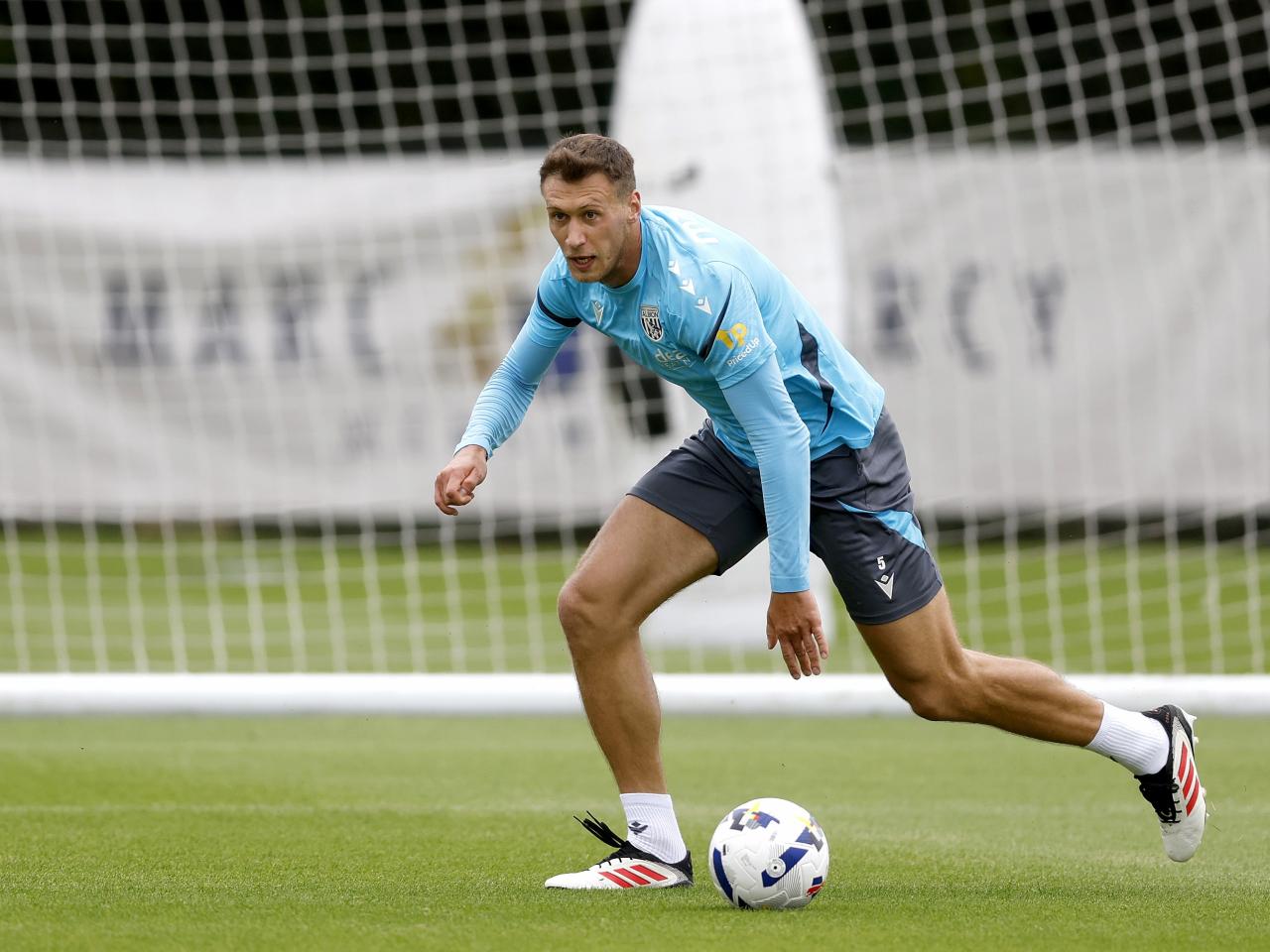 Krystian Bielik on the ball during training 