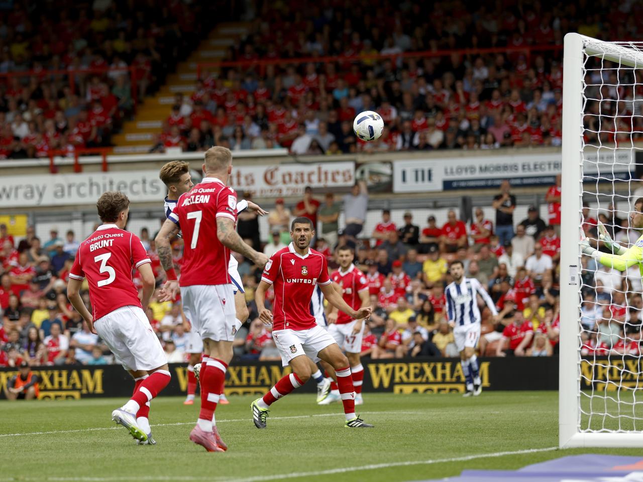 Isaac Price scoring a header against Wrexham 
