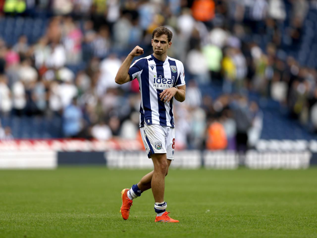 Jayson Molumby applauding WBA fans after the win over Blackburn