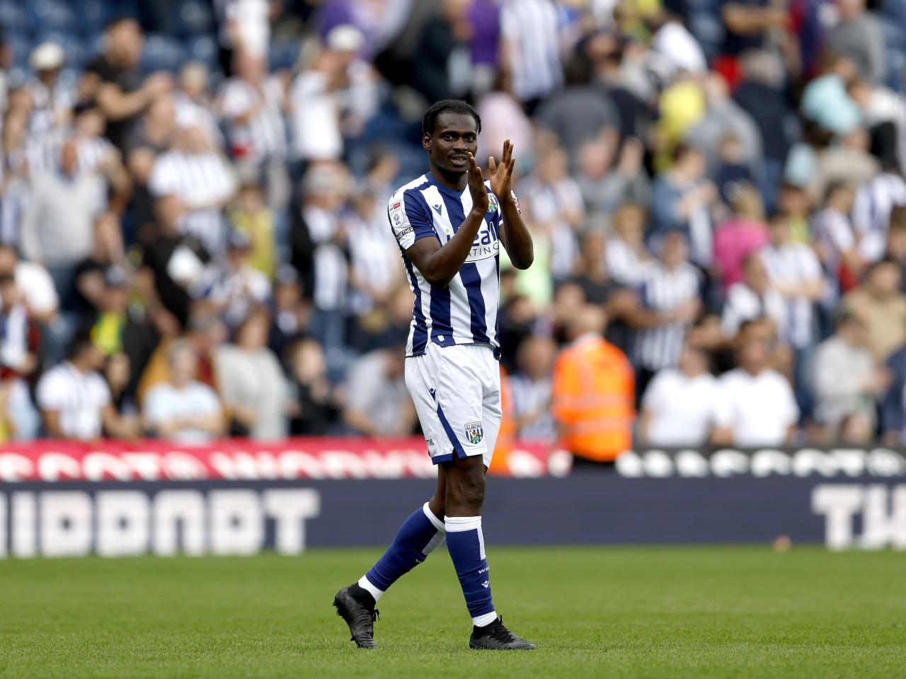 Ousmane Diakité applauding WBA fans after the win over Blackburn
