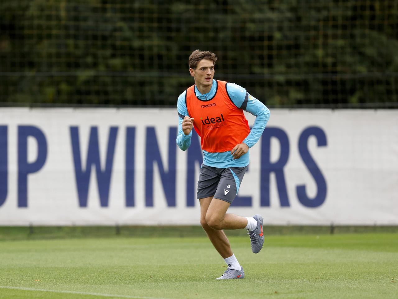 Caleb Taylor running forward during training 