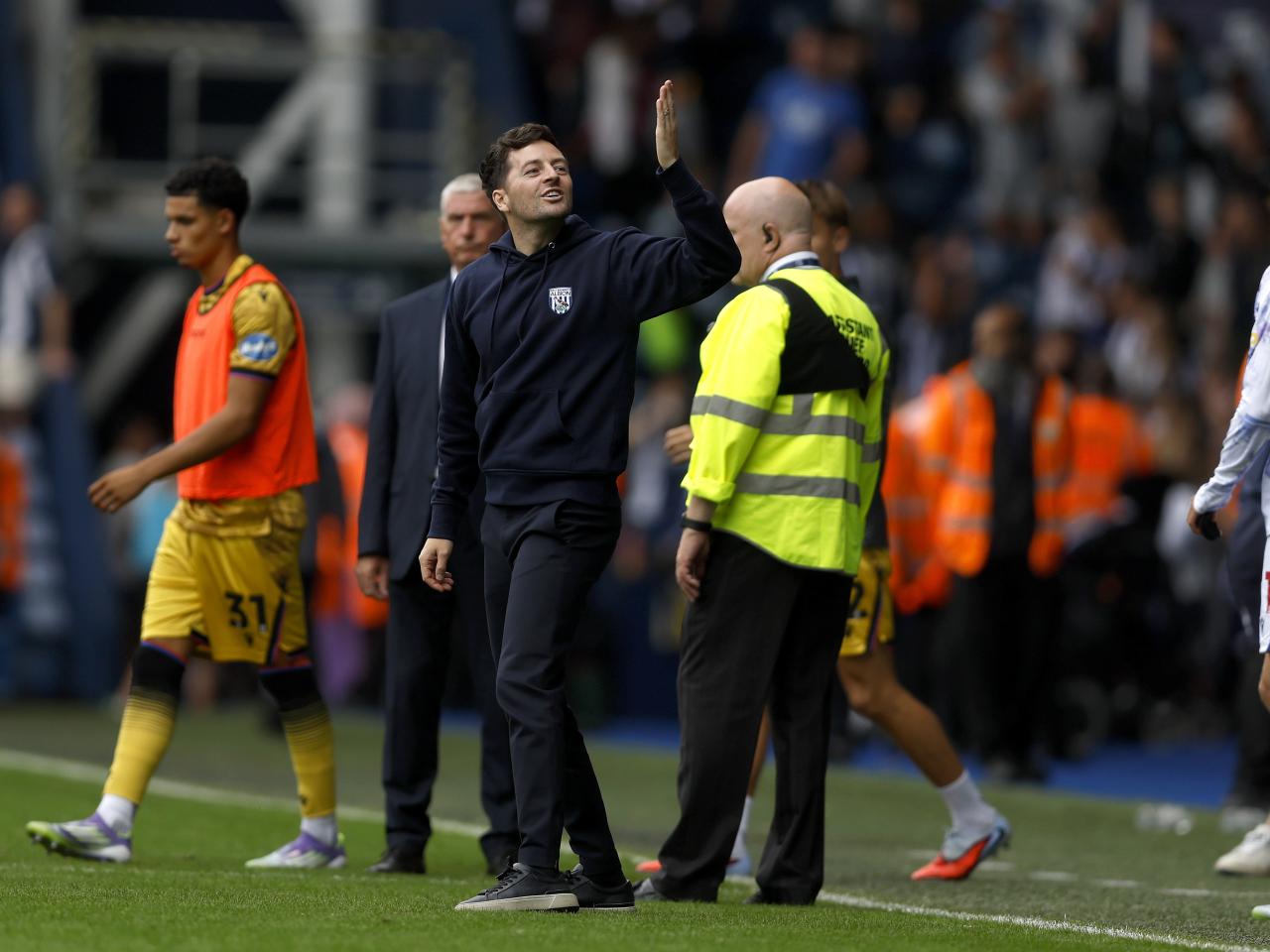 Ryan Mason blowing a kiss to his family while stood on the side of the pitch at The Hawthorns