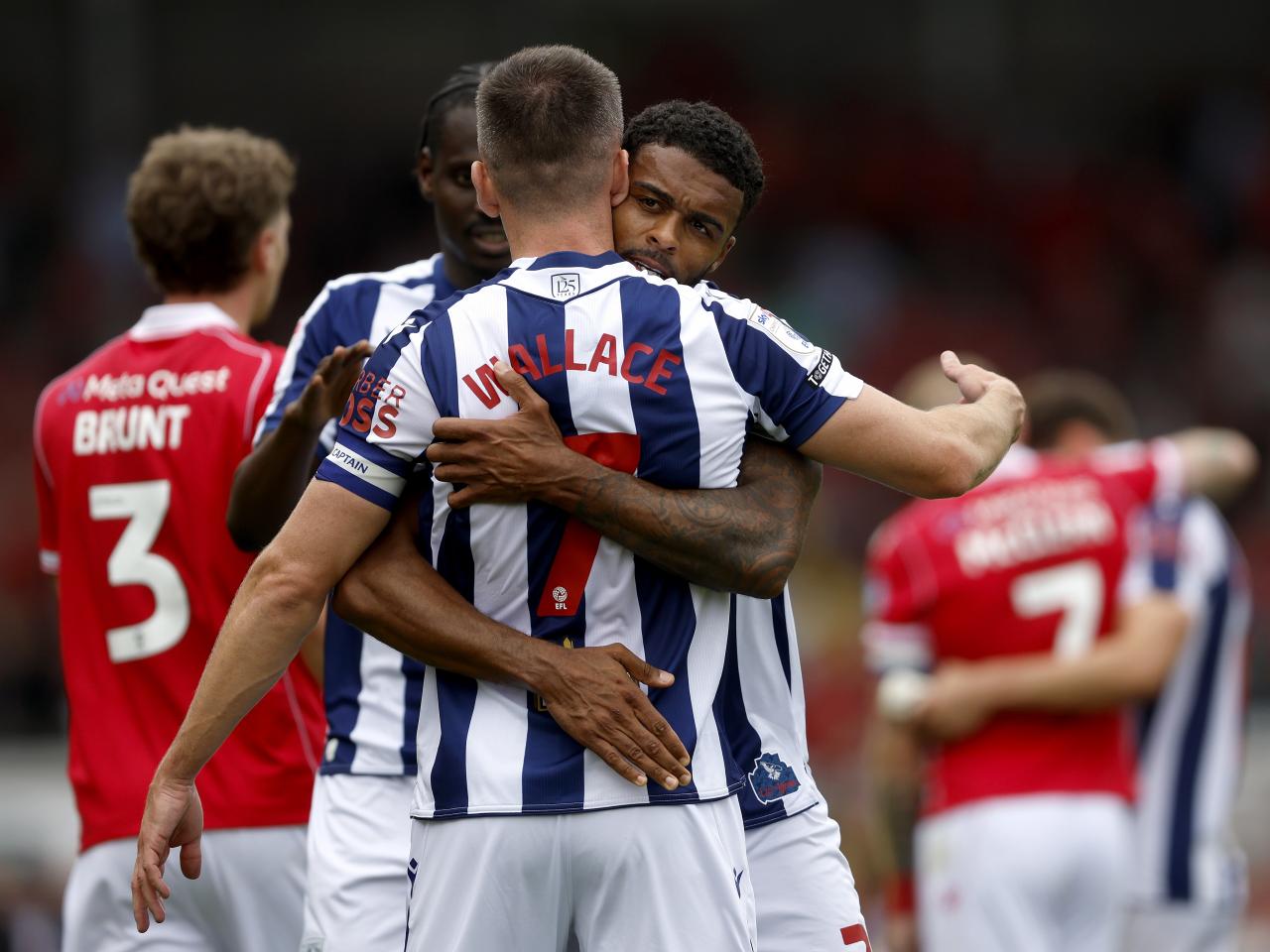 Jed Wallace and Darnell Furlong hug after beating Wrexham